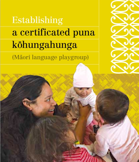 Brochure cover showing an adult with 2 toddlers and 1 baby. 