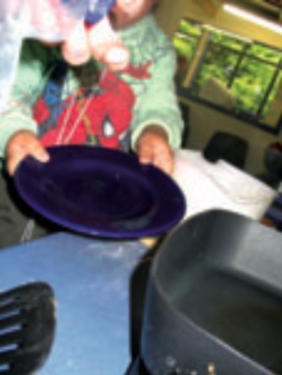 Child holding a plate