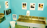 Sink with hand washing instruction posters.
