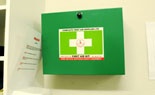 First Aid kit on wall accessible to staff.